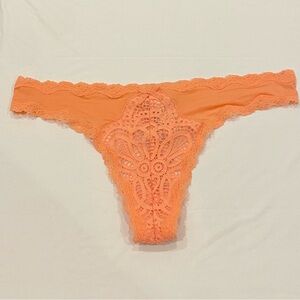 NEW WITH TAGS VICTORIA’S SECRET SIZE XS CORAL/ ORANGE LACE AND SATIN THONG